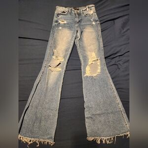 Flying Monkey High Rise Flare Jeans in Distressed Blue